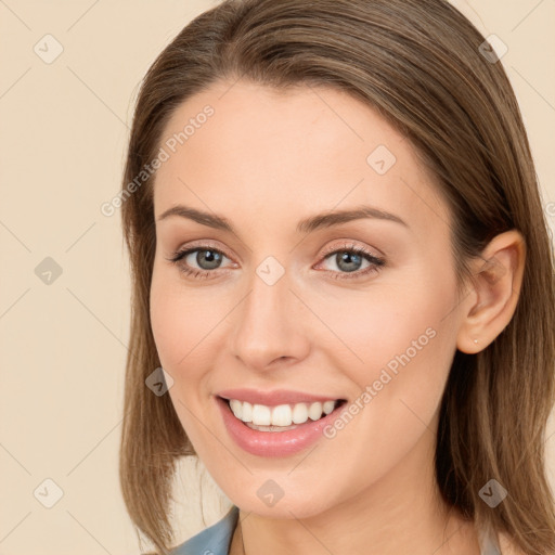 Joyful white young-adult female with long  brown hair and grey eyes