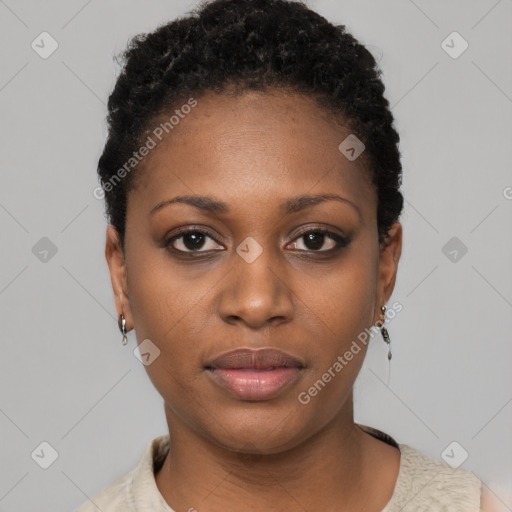 Joyful black young-adult female with short  black hair and brown eyes