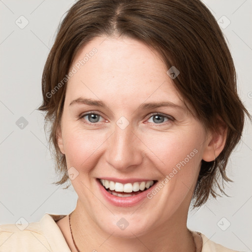 Joyful white young-adult female with medium  brown hair and grey eyes