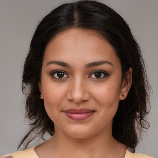 Joyful white young-adult female with medium  brown hair and brown eyes