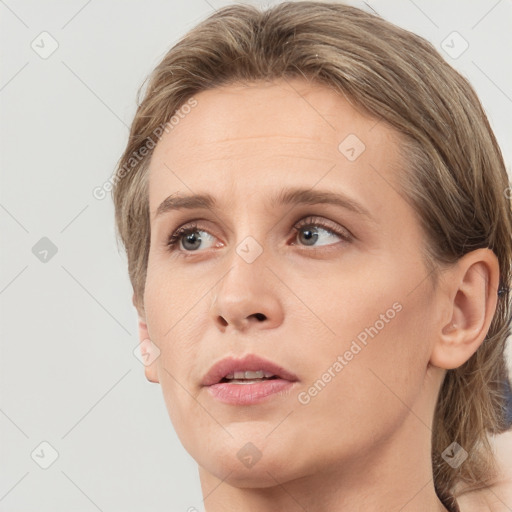 Neutral white young-adult female with medium  brown hair and grey eyes