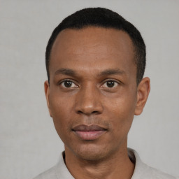 Neutral black young-adult male with short  black hair and brown eyes