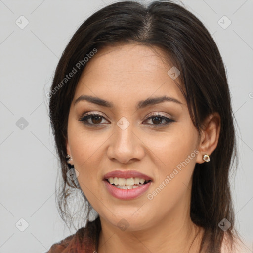 Joyful white young-adult female with long  brown hair and brown eyes