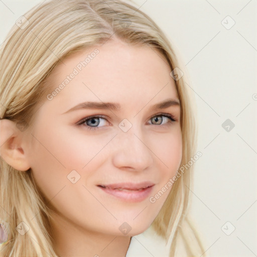 Joyful white young-adult female with long  brown hair and blue eyes