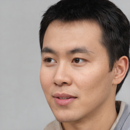 Neutral white young-adult male with short  black hair and brown eyes