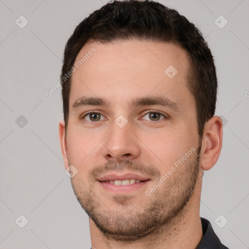 Joyful white young-adult male with short  brown hair and brown eyes