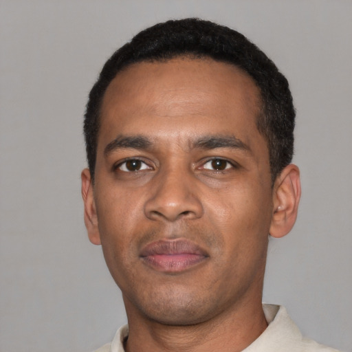 Neutral black young-adult male with short  black hair and brown eyes