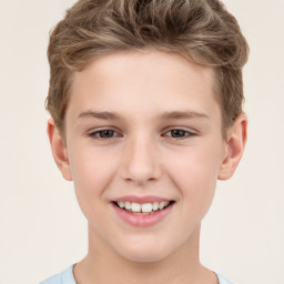 Joyful white child male with short  brown hair and brown eyes