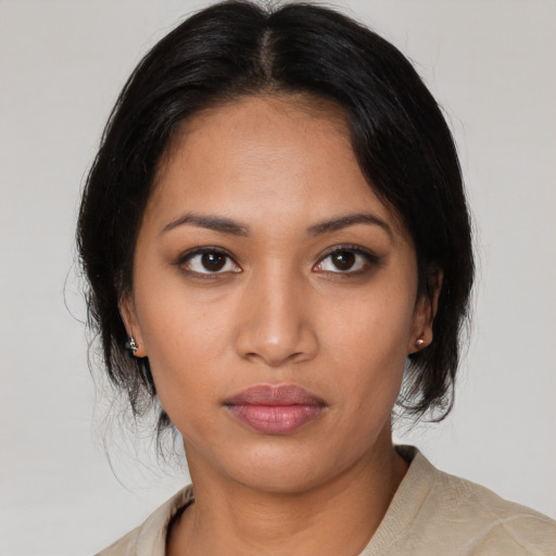 Neutral latino young-adult female with medium  black hair and brown eyes