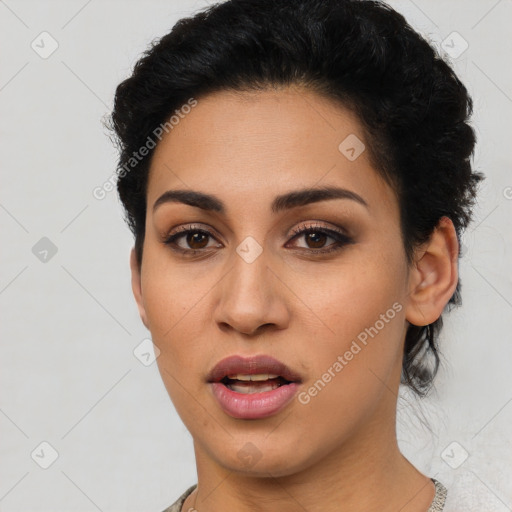 Joyful latino young-adult female with short  brown hair and brown eyes