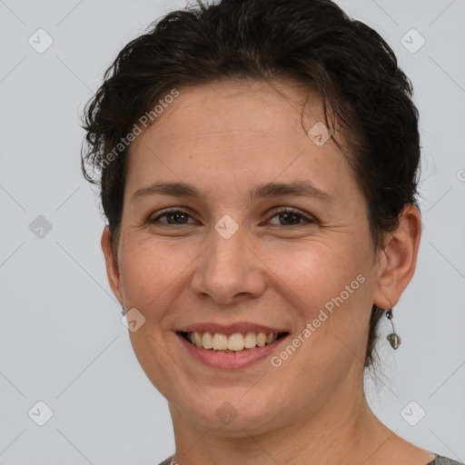 Joyful white adult female with short  brown hair and brown eyes