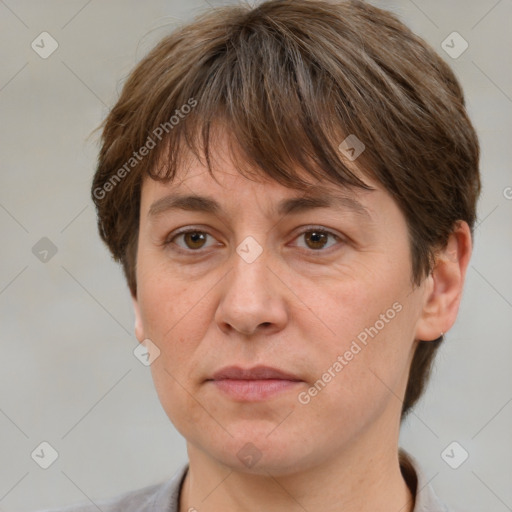 Joyful white adult female with short  brown hair and grey eyes