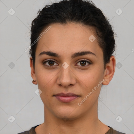 Joyful latino young-adult female with short  brown hair and brown eyes