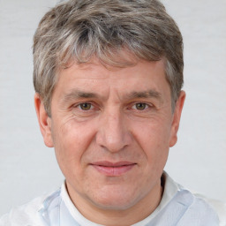 Joyful white middle-aged male with short  brown hair and brown eyes