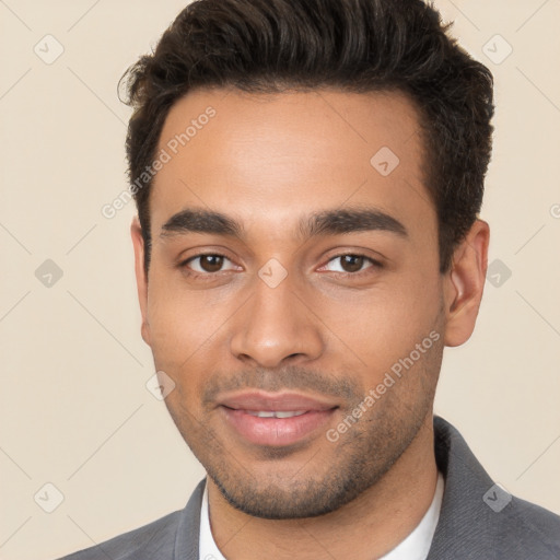 Joyful white young-adult male with short  black hair and brown eyes