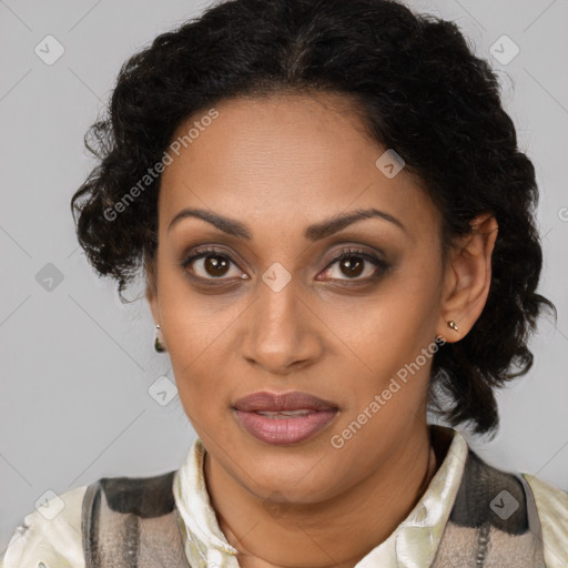 Joyful black young-adult female with medium  brown hair and brown eyes