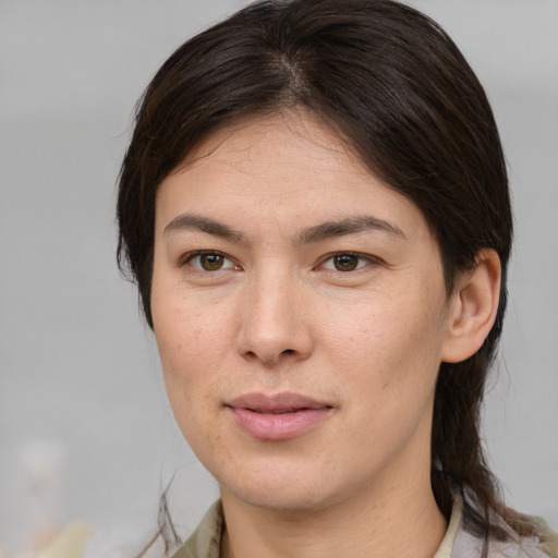 Joyful white young-adult female with medium  brown hair and brown eyes