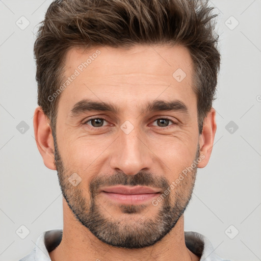 Joyful white adult male with short  brown hair and brown eyes