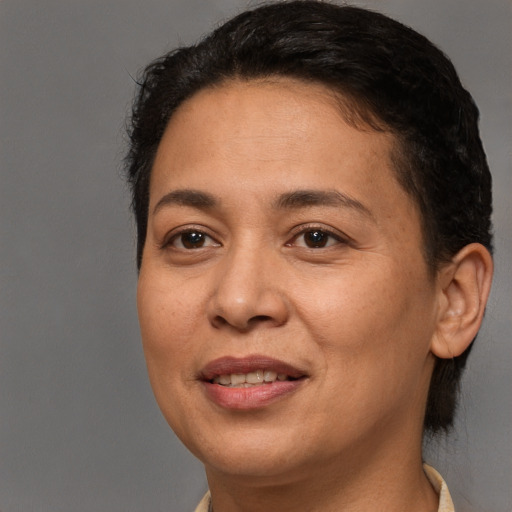 Joyful white adult female with short  brown hair and brown eyes