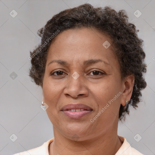 Joyful black adult female with short  brown hair and brown eyes