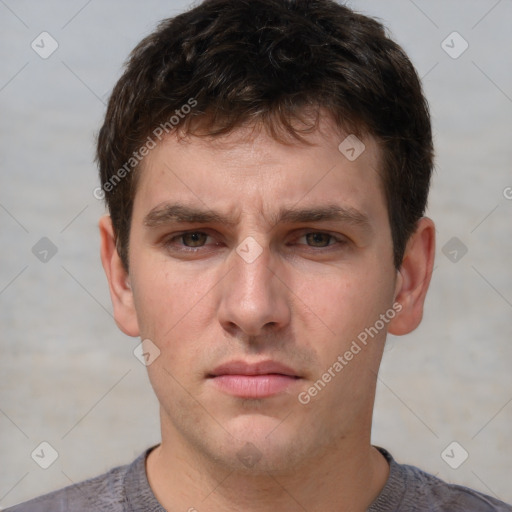 Neutral white young-adult male with short  brown hair and grey eyes