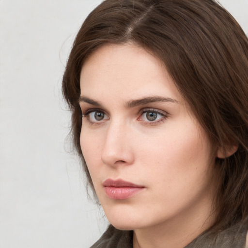 Neutral white young-adult female with medium  brown hair and grey eyes