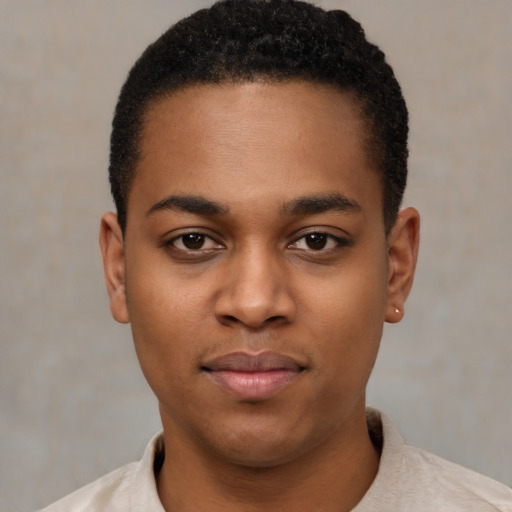 Joyful black young-adult male with short  black hair and brown eyes