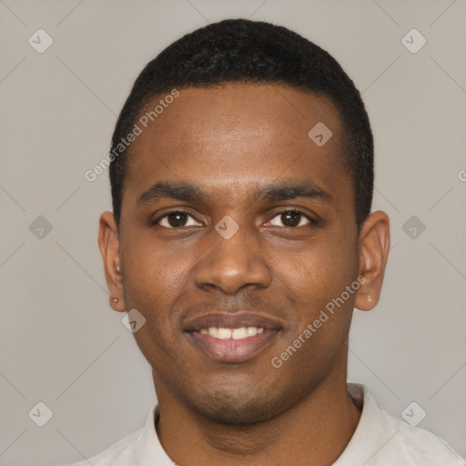 Joyful black young-adult male with short  black hair and brown eyes