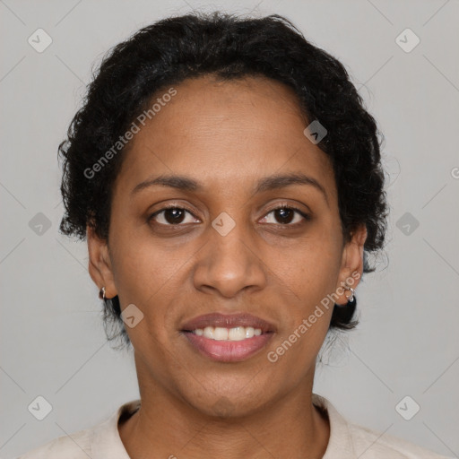 Joyful black adult female with short  brown hair and brown eyes