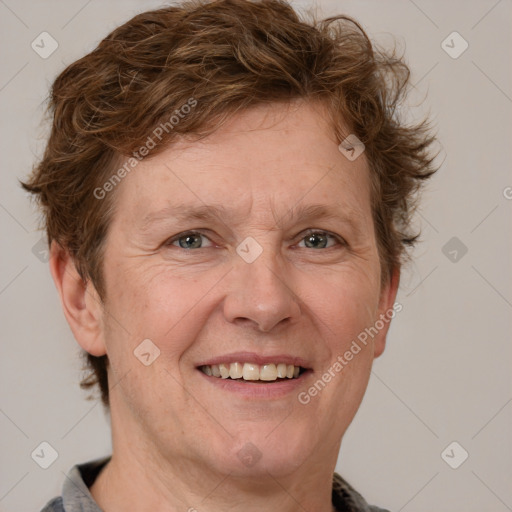 Joyful white adult female with short  brown hair and grey eyes