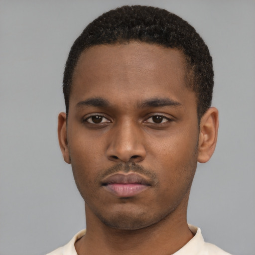 Neutral latino young-adult male with short  brown hair and brown eyes