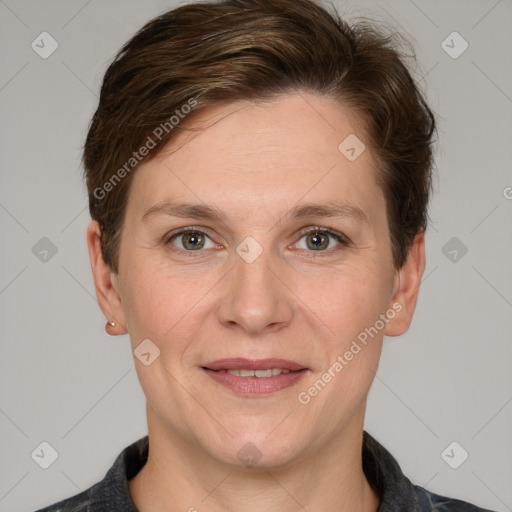 Joyful white adult female with short  brown hair and grey eyes