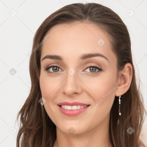 Joyful white young-adult female with long  brown hair and blue eyes