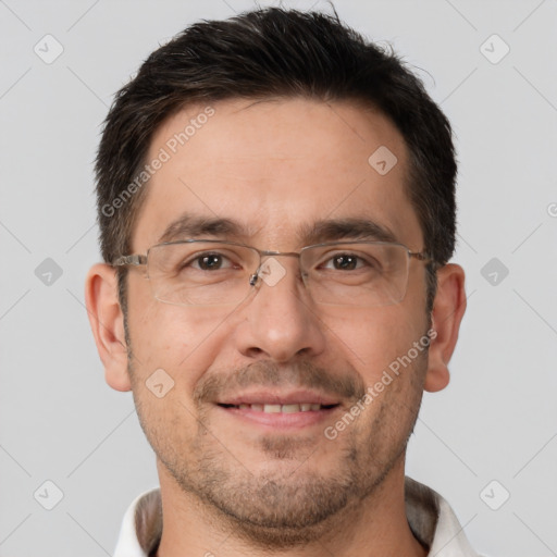 Joyful white adult male with short  brown hair and brown eyes