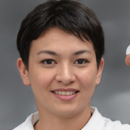 Joyful asian young-adult female with short  brown hair and brown eyes