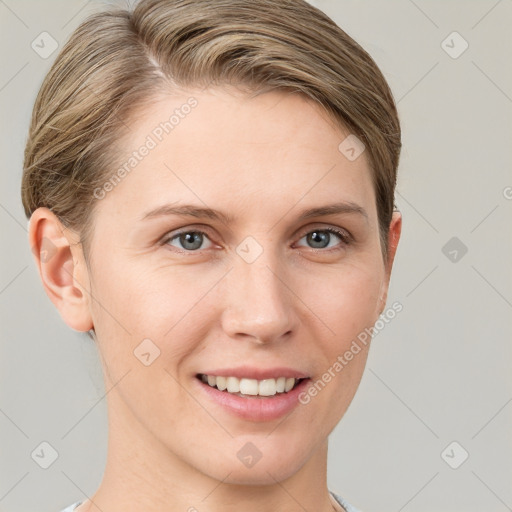 Joyful white young-adult female with short  brown hair and grey eyes