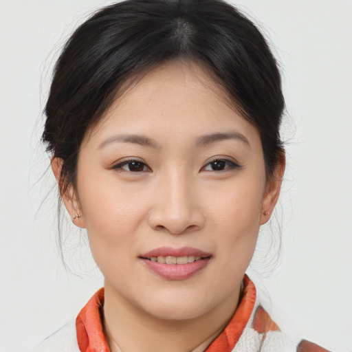 Joyful asian young-adult female with medium  brown hair and brown eyes