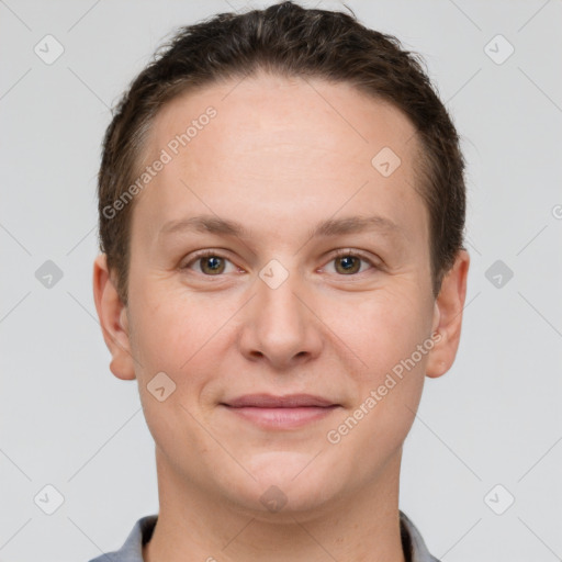 Joyful white adult female with short  brown hair and grey eyes