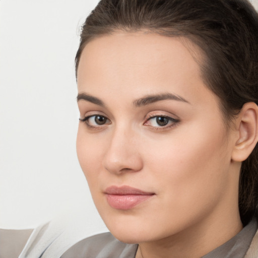 Neutral white young-adult female with medium  brown hair and brown eyes