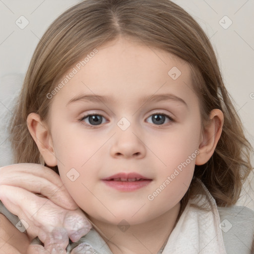 Joyful white child female with medium  brown hair and blue eyes