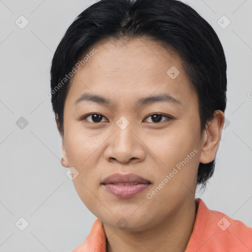 Joyful asian young-adult female with short  black hair and brown eyes