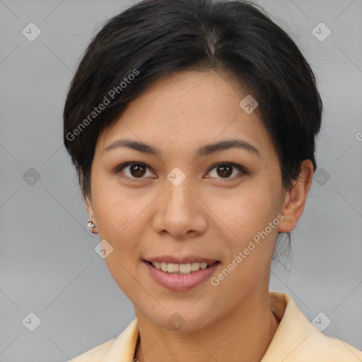 Joyful asian young-adult female with short  brown hair and brown eyes