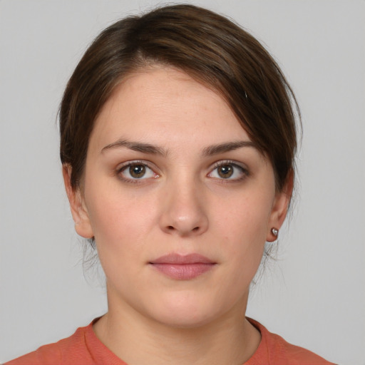 Neutral white young-adult female with medium  brown hair and brown eyes