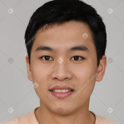 Joyful asian young-adult male with short  black hair and brown eyes