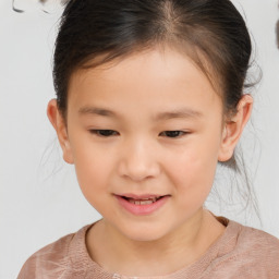 Joyful white child female with short  brown hair and brown eyes