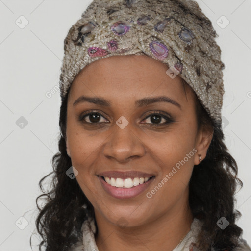 Joyful black young-adult female with long  brown hair and brown eyes