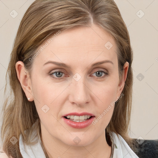 Joyful white young-adult female with medium  brown hair and blue eyes