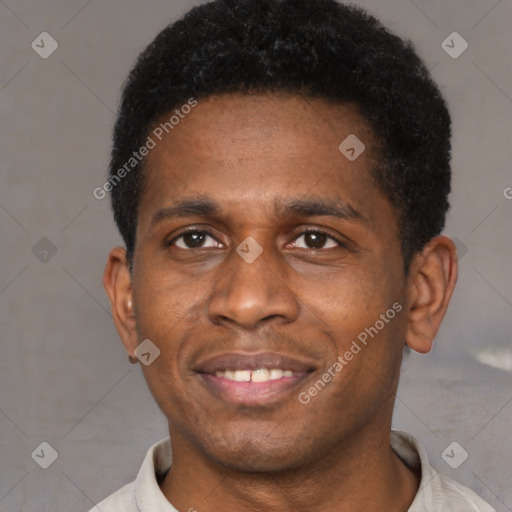 Joyful black young-adult male with short  brown hair and brown eyes