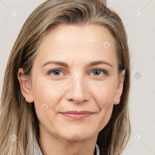 Joyful white adult female with long  brown hair and brown eyes