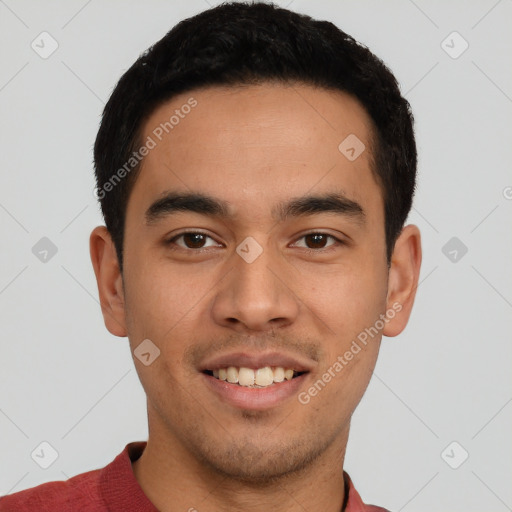 Joyful white young-adult male with short  black hair and brown eyes